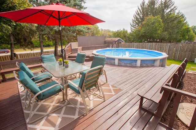 view of swimming pool featuring a wooden deck