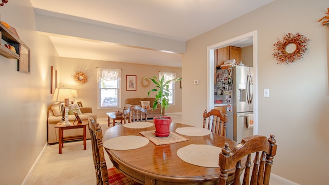 view of carpeted dining area