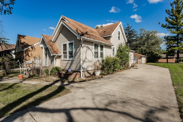 view of side of home with a yard