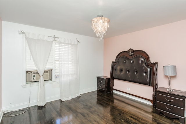 bedroom featuring cooling unit, a chandelier, and dark hardwood / wood-style flooring