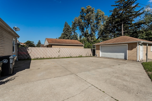 exterior space with an outbuilding and a garage