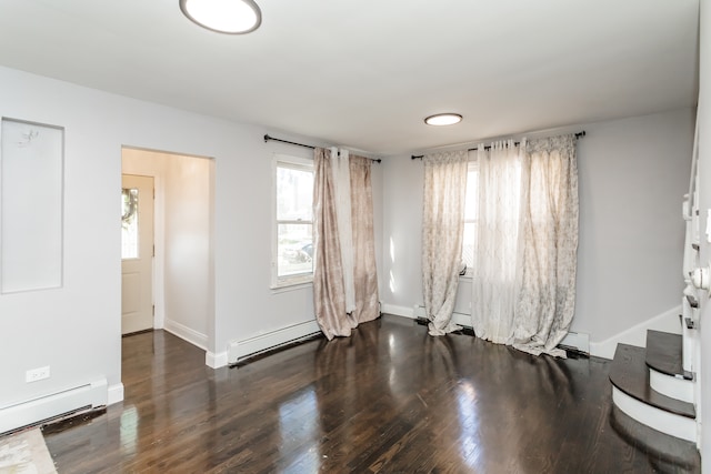 unfurnished room with a baseboard radiator and dark wood-type flooring