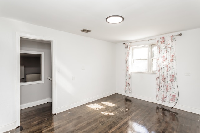 empty room featuring dark hardwood / wood-style floors