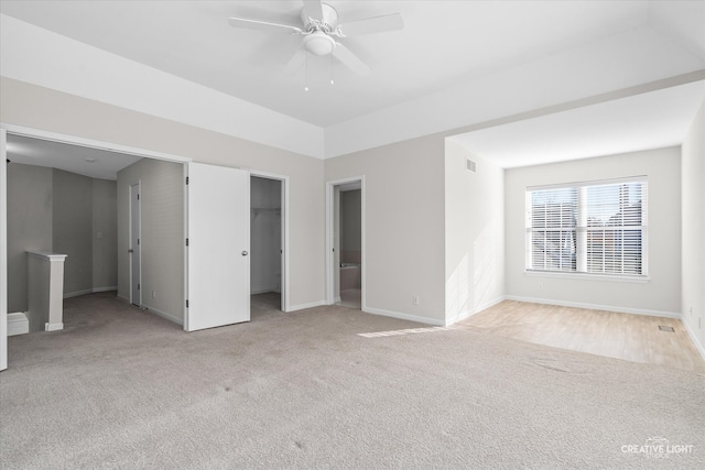 unfurnished bedroom featuring ceiling fan and light colored carpet