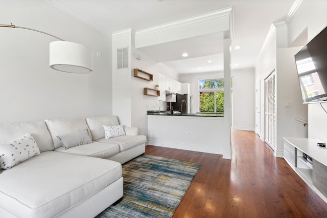 living room with dark hardwood / wood-style floors and ornamental molding