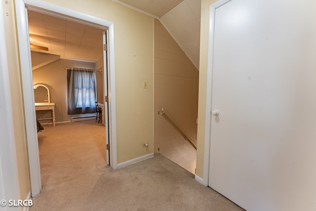 corridor with lofted ceiling and light carpet