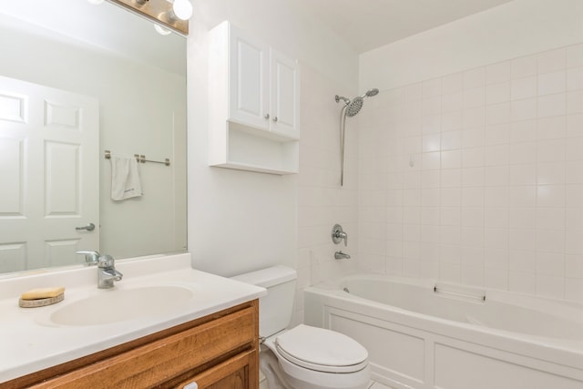 full bathroom with vanity, toilet, and tiled shower / bath combo