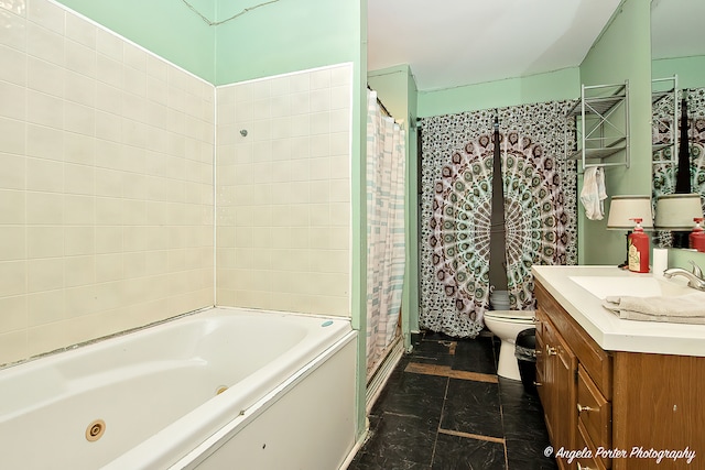 full bathroom featuring vanity, shower with separate bathtub, and toilet