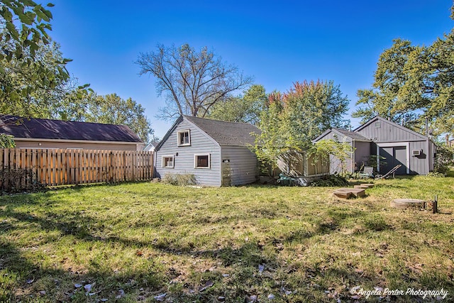 3012 Oakwood Ave, Mchenry, IL 60051 - view of yard featuring fence, an outbuilding, and a storage unit