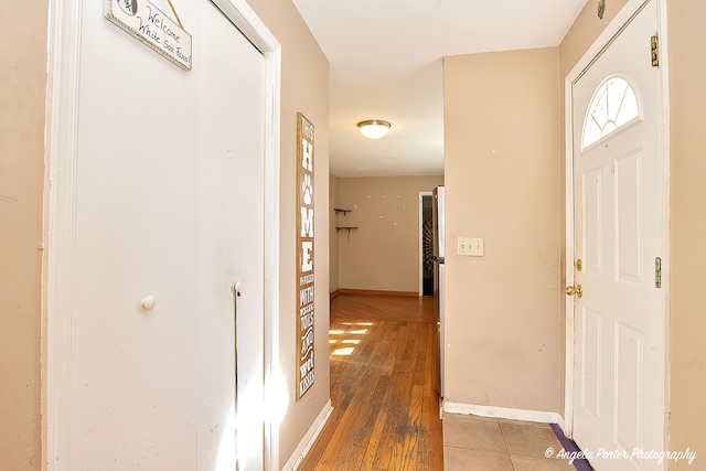 foyer entrance with hardwood / wood-style floors