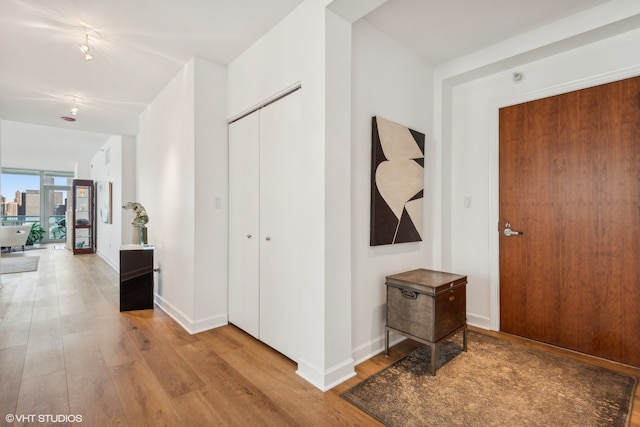 corridor featuring light hardwood / wood-style flooring