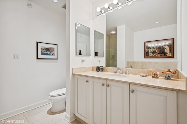 bathroom featuring vanity, tile patterned flooring, toilet, and walk in shower