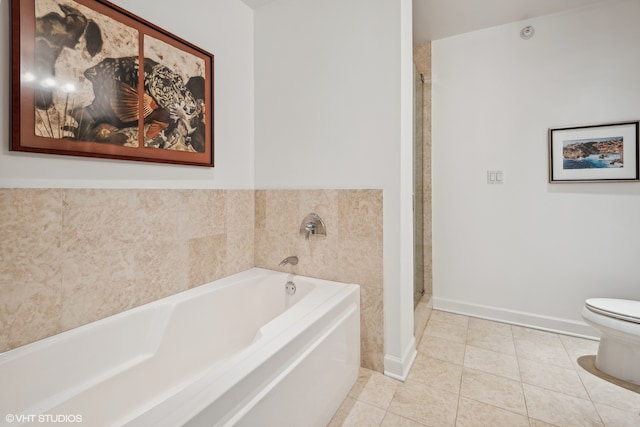 bathroom featuring tile patterned floors, toilet, and independent shower and bath