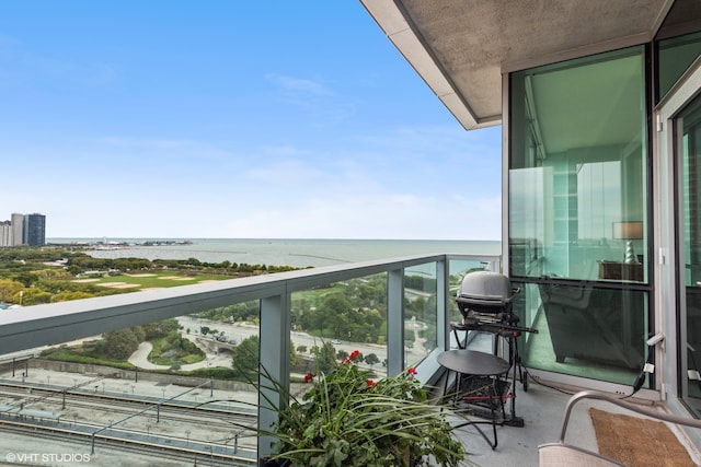 balcony featuring a water view