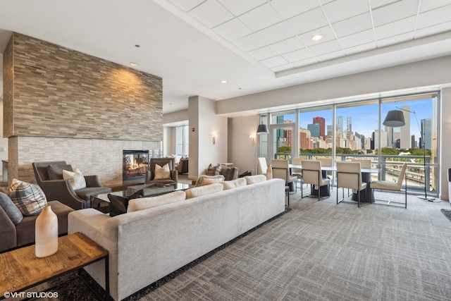 carpeted living room with a multi sided fireplace