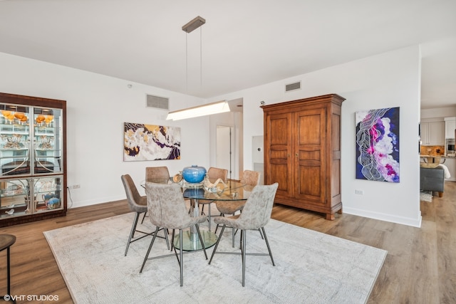 dining area with light wood-type flooring