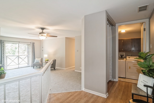 interior space with light hardwood / wood-style floors and washer and clothes dryer