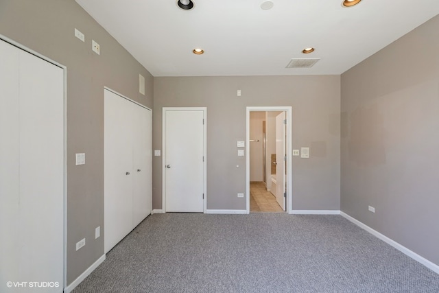 unfurnished bedroom with light carpet