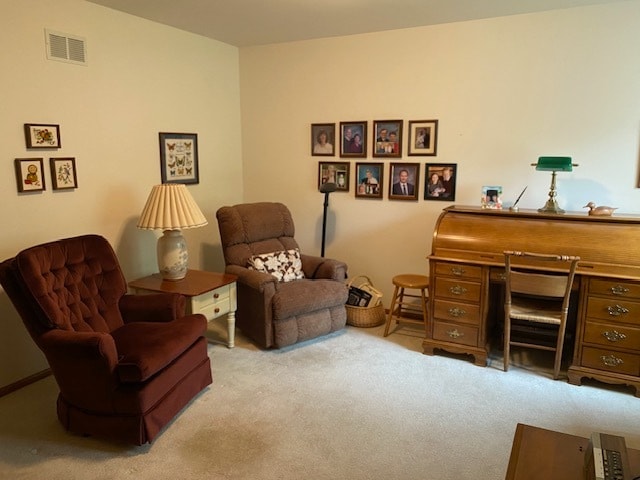 living area with light carpet