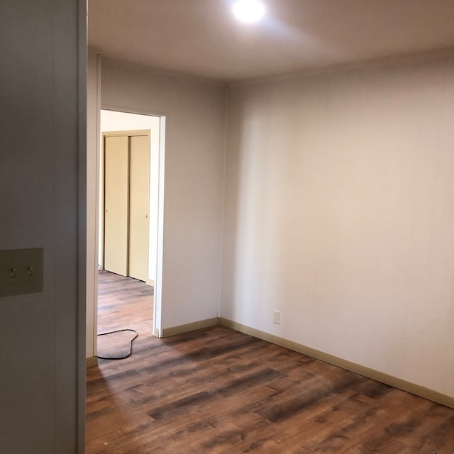 spare room featuring dark hardwood / wood-style flooring