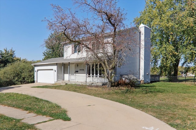 view of front of house with a front lawn, a porch, and a garage