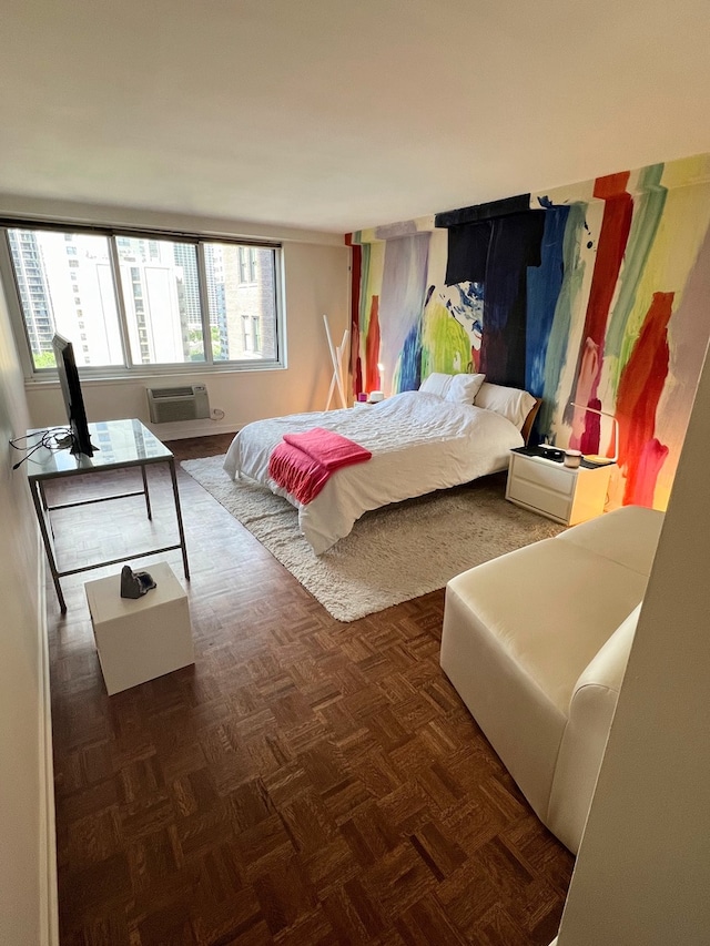 bedroom featuring dark parquet flooring and a wall mounted AC