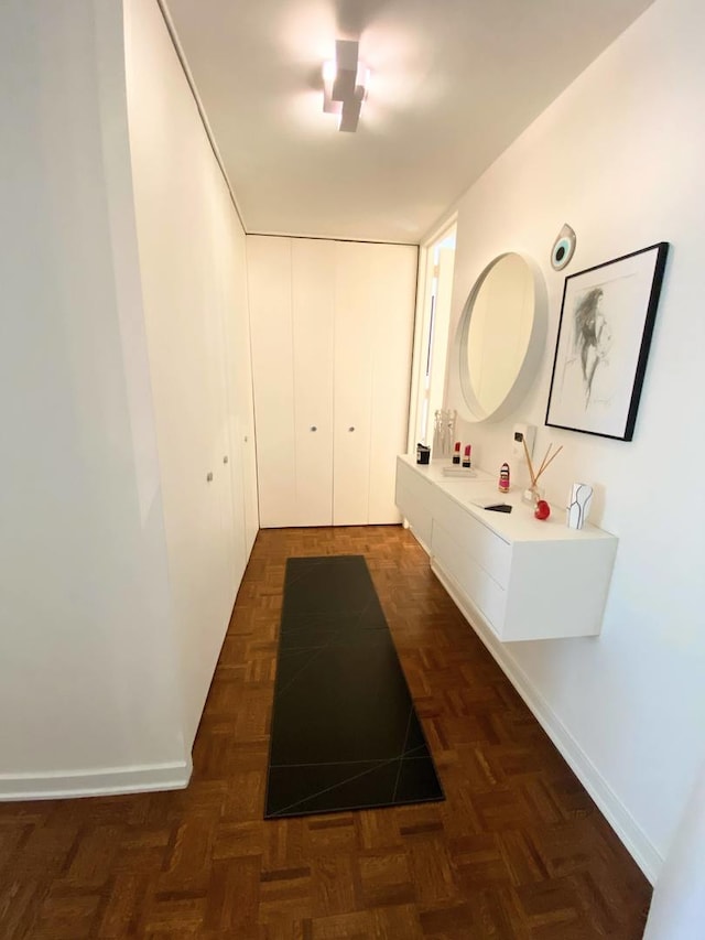 bathroom featuring parquet flooring