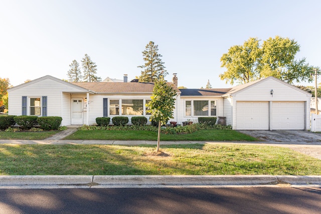 ranch-style home with a front yard and a garage