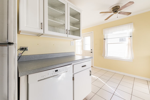 kitchen featuring ceiling fan, light tile patterned flooring, white appliances, white cabinetry, and crown molding