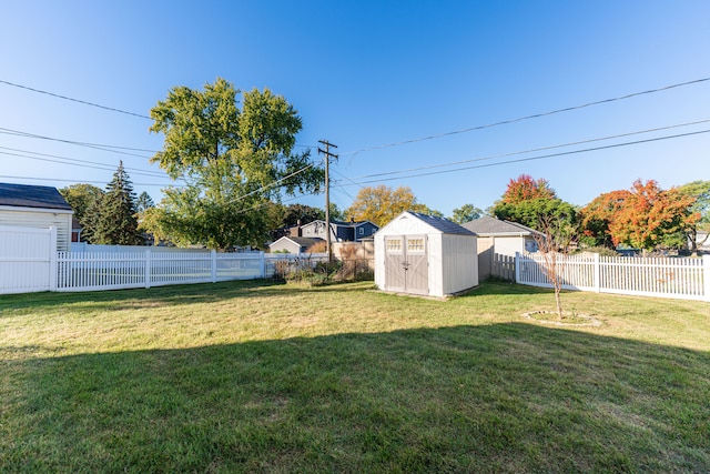 view of yard featuring a storage unit