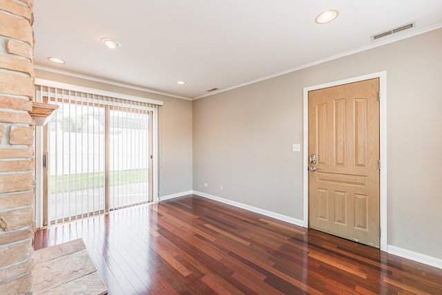 unfurnished room with dark hardwood / wood-style floors and crown molding