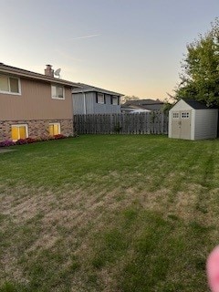 yard at dusk with a shed