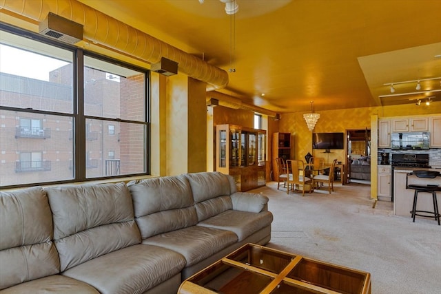 carpeted living room featuring ceiling fan