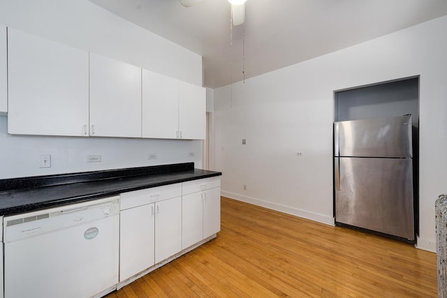 kitchen featuring light hardwood / wood-style flooring, stainless steel refrigerator, ceiling fan, white dishwasher, and white cabinets