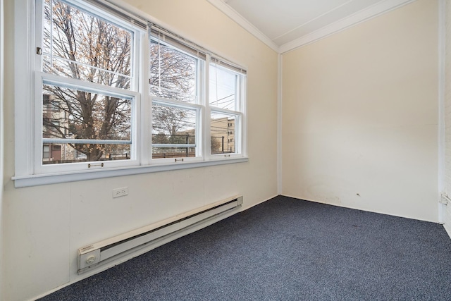 empty room with baseboard heating, crown molding, and carpet