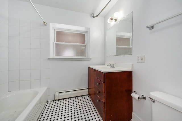 full bathroom featuring vanity, tiled shower / bath combo, toilet, and baseboard heating