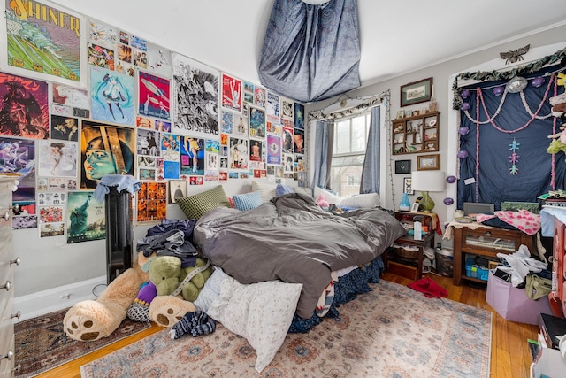 bedroom featuring wood finished floors