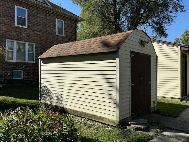 view of outdoor structure with a lawn