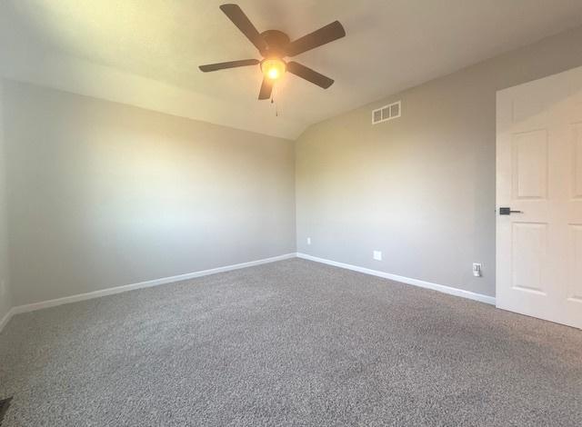 2501 Woodridge Pl, Champaign, IL 61822 - spare room with ceiling fan, baseboards, carpet floors, and lofted ceiling