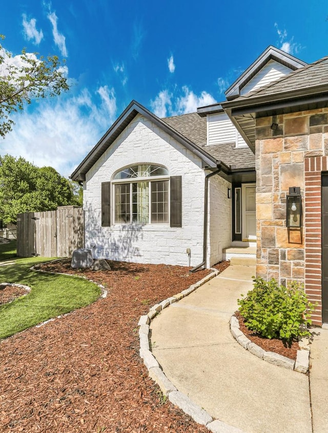 2501 Woodridge Pl, Champaign, IL 61822 - view of front of property with stone siding and roof with shingles