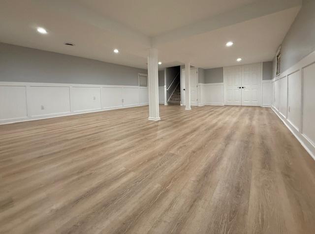 2501 Woodridge Pl, Champaign, IL 61822 - finished below grade area with a decorative wall, wood finished floors, recessed lighting, and wainscoting