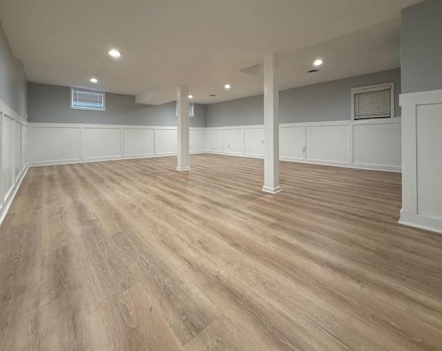 2501 Woodridge Pl, Champaign, IL 61822 - basement with light wood-style floors, a decorative wall, a wainscoted wall, and recessed lighting