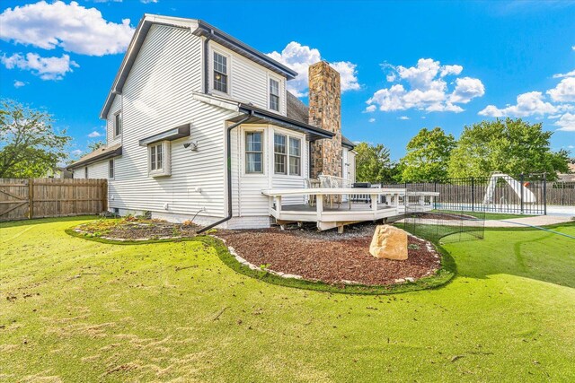2501 Woodridge Pl, Champaign, IL 61822 - back of house featuring a deck and a chimney