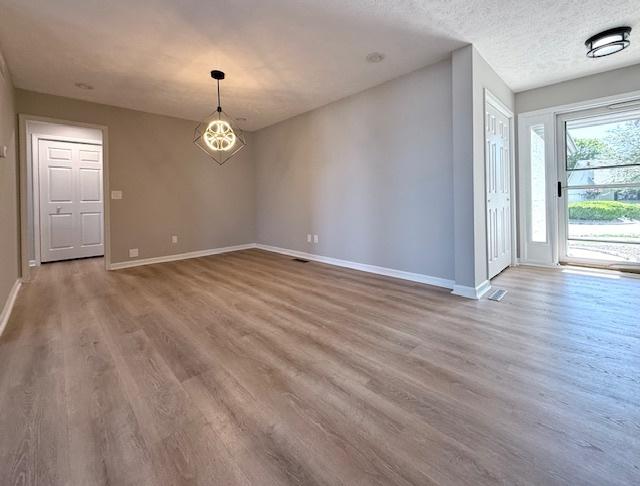 2501 Woodridge Pl, Champaign, IL 61822 - foyer with wood finished floors and baseboards