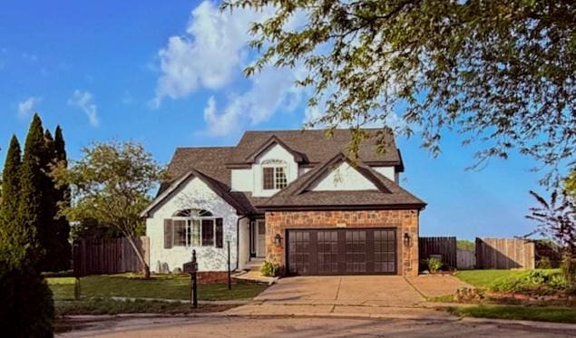2501 Woodridge Pl, Champaign, IL 61822 - view of front of house with driveway and an attached garage