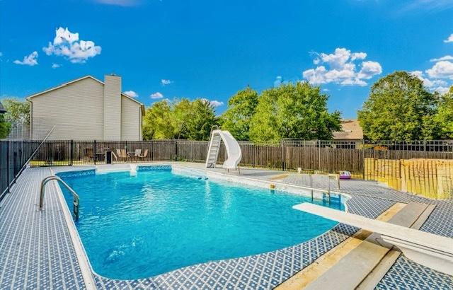 2501 Woodridge Pl, Champaign, IL 61822 - view of swimming pool featuring a water slide and a diving board