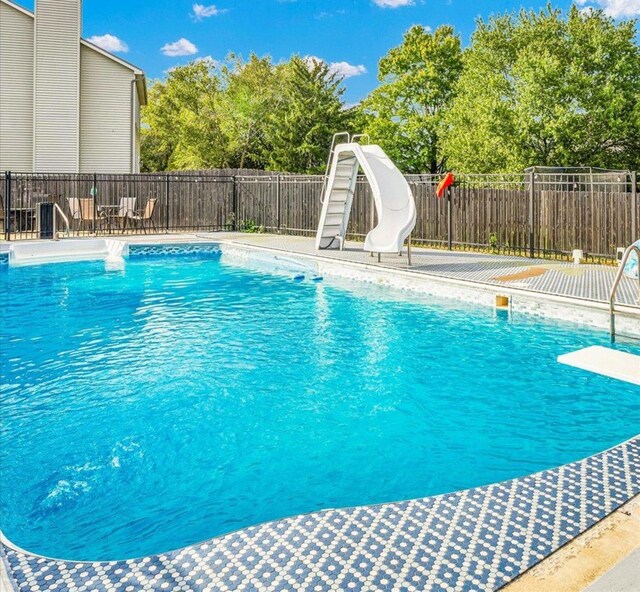 2501 Woodridge Pl, Champaign, IL 61822 - view of pool featuring a water slide, a diving board, and view of scattered trees