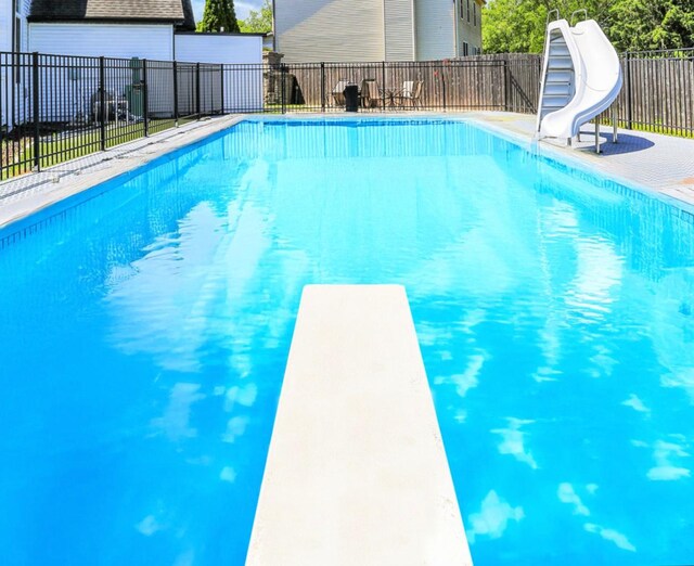 2501 Woodridge Pl, Champaign, IL 61822 - view of swimming pool featuring a water slide and a diving board