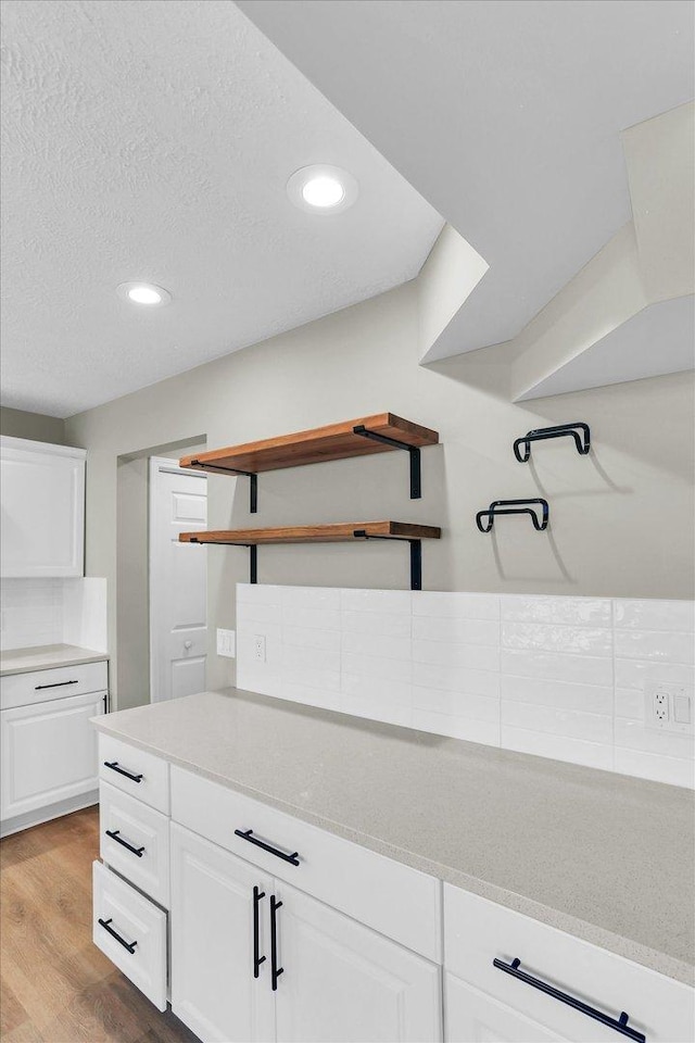 2501 Woodridge Pl, Champaign, IL 61822 - kitchen featuring open shelves, white cabinets, light wood-style floors, recessed lighting, and a textured ceiling