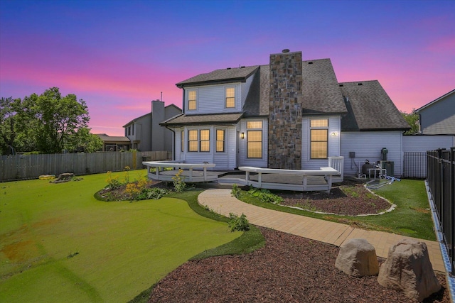 2501 Woodridge Pl, Champaign, IL 61822 - back of property at dusk with a chimney and a shingled roof